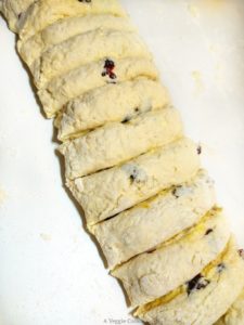 Vegan scone dough with orange butter cut into slices