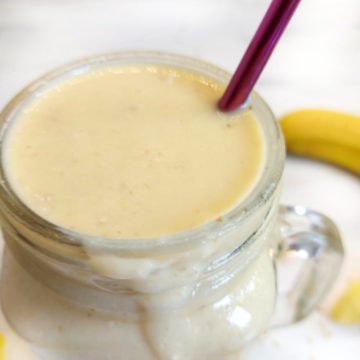 Glass containing mango and Pineapple Smoothie